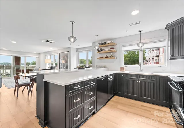 a kitchen with a sink and cabinets