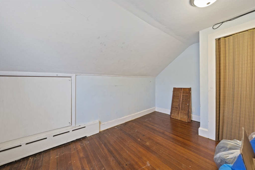 14 Foster Street Avon, MA 02322 - Photo 23 of 33 a view of an empty room with wooden floor and a window