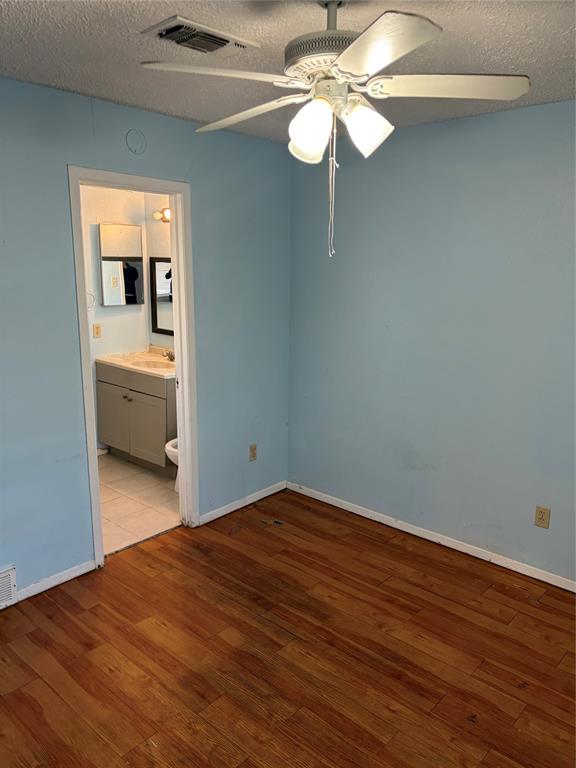 13360 Southview Lane Dallas, TX 75240 - Photo 17 of 26 a view of empty room with wooden floor