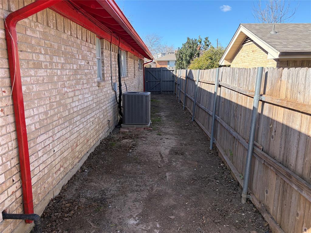 13360 Southview Lane Dallas, TX 75240 - Photo 23 of 26 a view of a pathway of a house with wooden fence