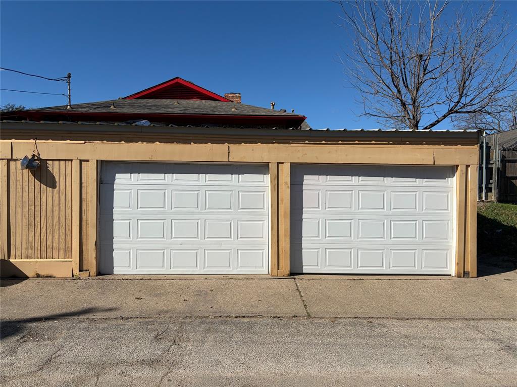 13360 Southview Lane Dallas, TX 75240 - Photo 25 of 26 a front view of a house with a garage