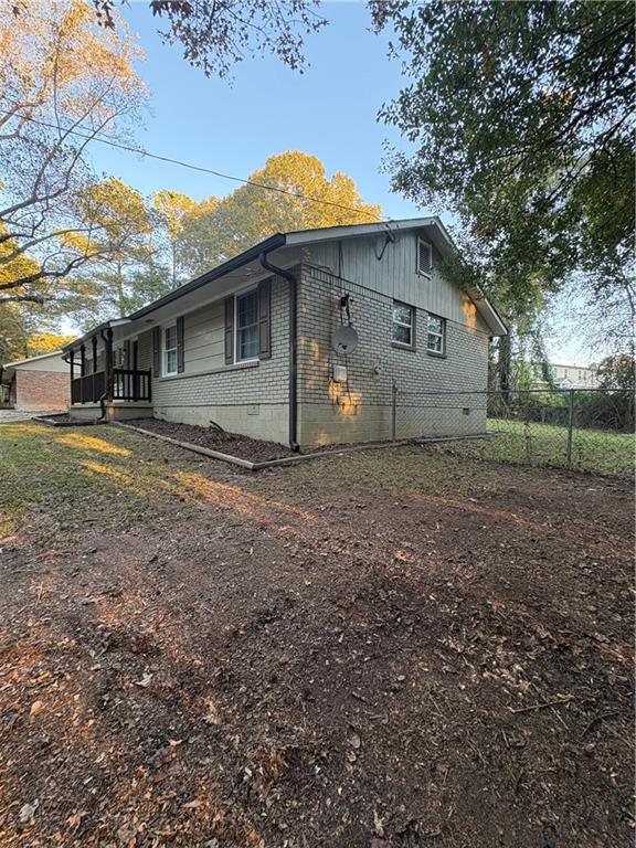 657 Utoy Court Jonesboro, GA 30238 - Photo 12 of 29 a front view of a house with a yard