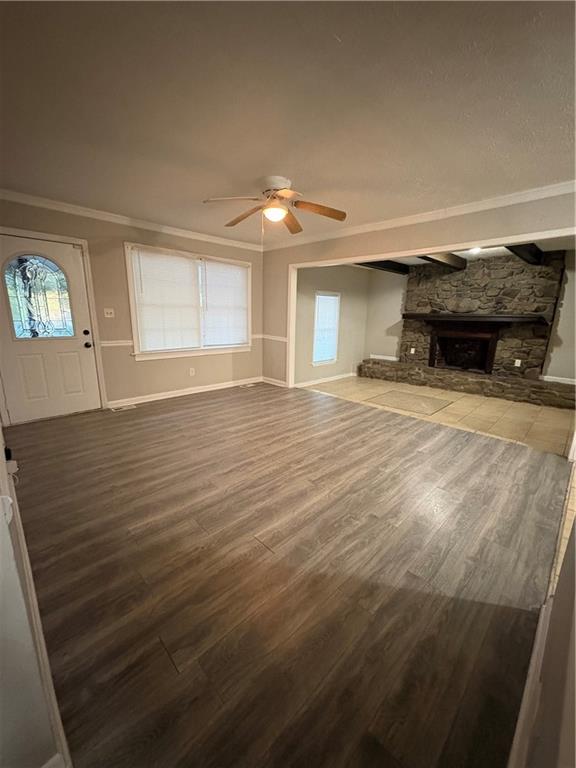 657 Utoy Court Jonesboro, GA 30238 - Photo 13 of 29 en empty room with windows and fireplace