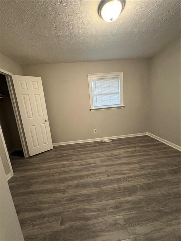 657 Utoy Court Jonesboro, GA 30238 - Photo 17 of 29 a view of a room with wooden floor and white walls