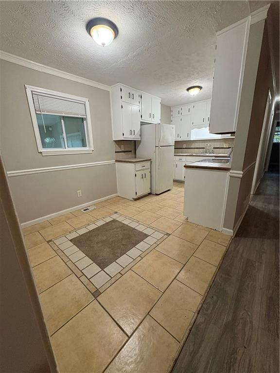 657 Utoy Court Jonesboro, GA 30238 - Photo 22 of 29 a kitchen with granite countertop a stove a sink and a refrigerator