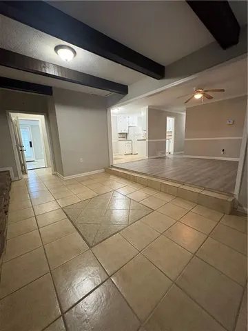 a view of a livingroom with an empty space and a sink