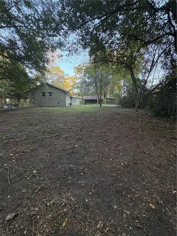 a view of a yard with a tree
