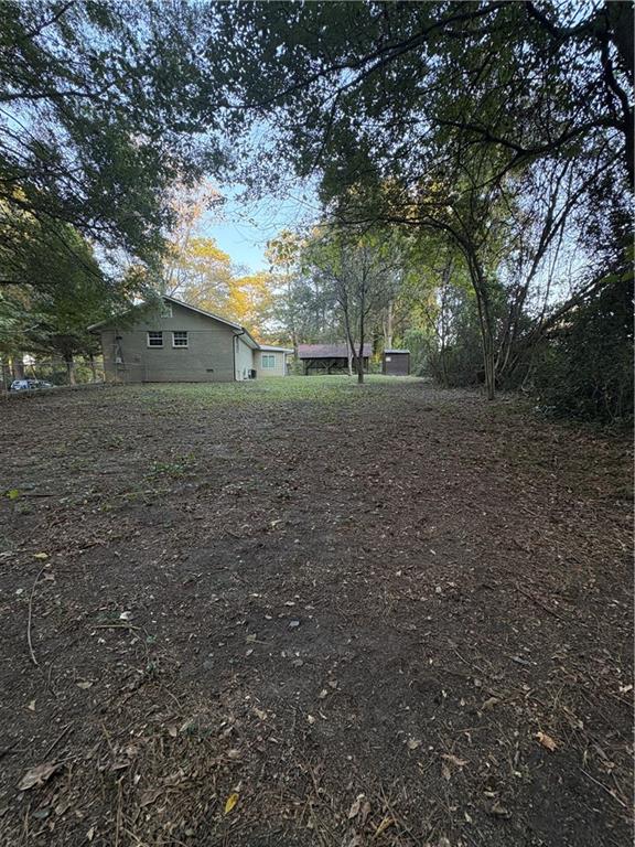 657 Utoy Court Jonesboro, GA 30238 - Photo 10 of 29 a view of a yard with a tree
