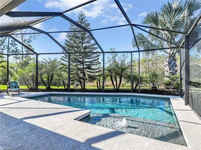 a view of a room with a window and wooden floor
