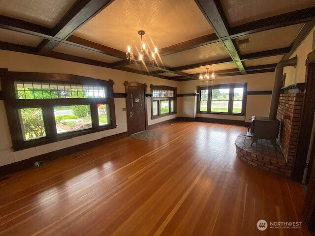 0 East Badger Road Lynden, WA 98264 - Photo 26 of 34 a view of an empty room with wooden floor and windows