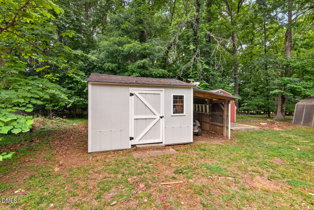 1420 Goodwin Road Durham, NC 27712 - Photo 37 of 54 a house with trees in the background