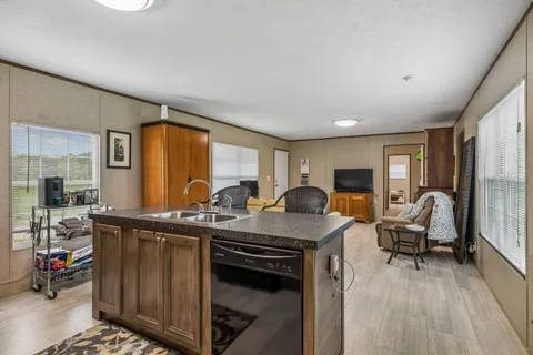 a kitchen with stainless steel appliances granite countertop a stove and a refrigerator