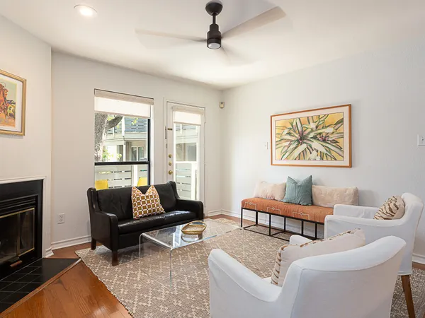 a living room with furniture and a fireplace