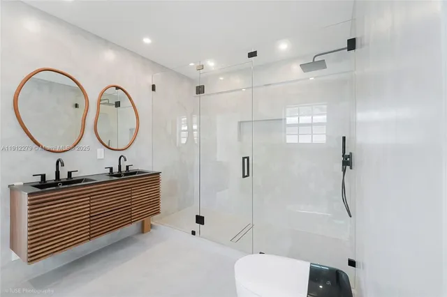 a bathroom with a toilet a sink and a mirror