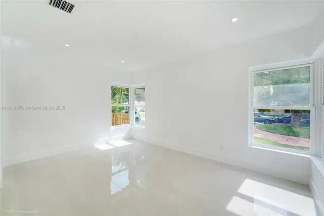 an empty room with windows