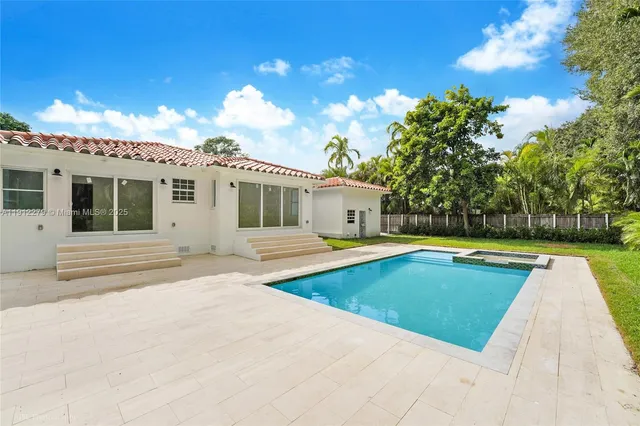 a view of a house with swimming pool