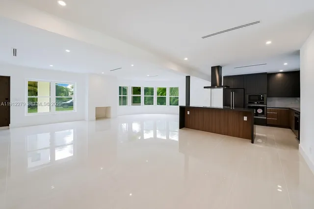 a view of a kitchen with a sink and a window