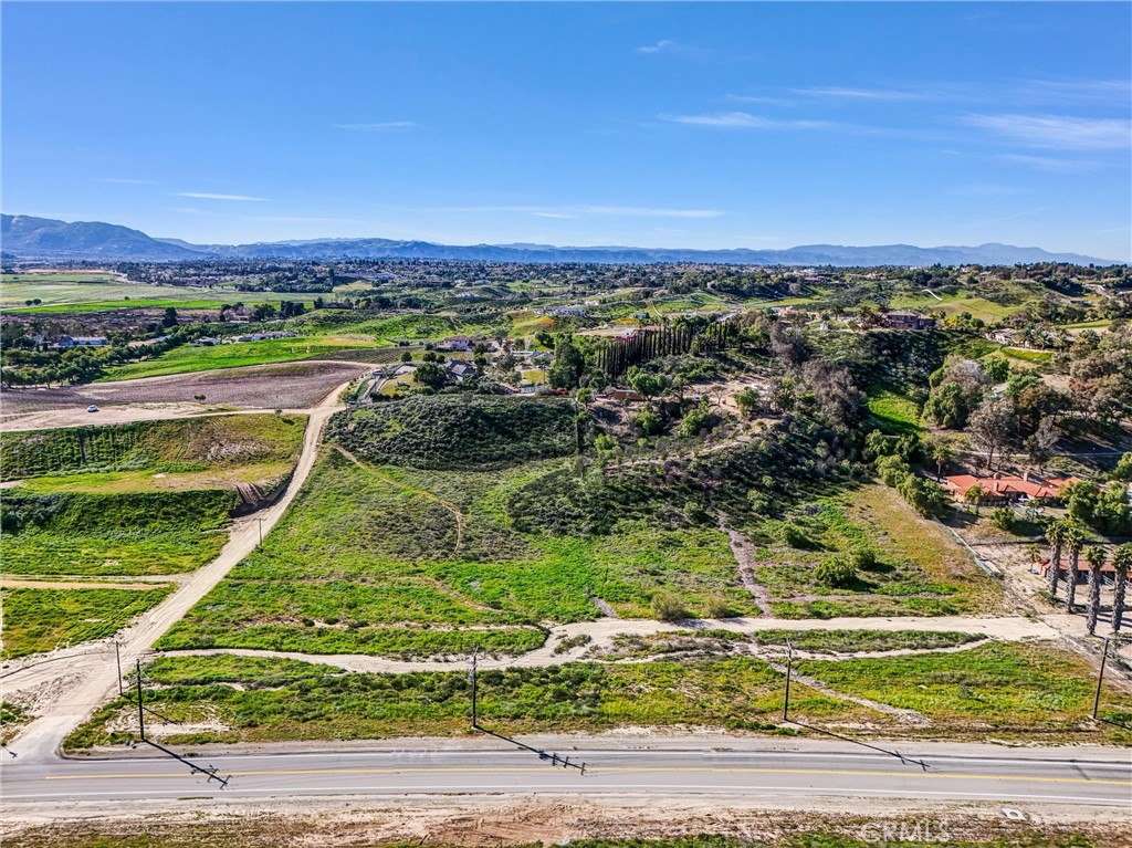 42780 India Place Temecula, CA 92592 - Photo 3 of 16 an aerial view of a golf course with a lake view