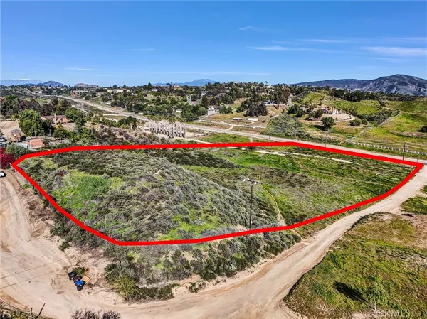 a view of a yard with an ocean view