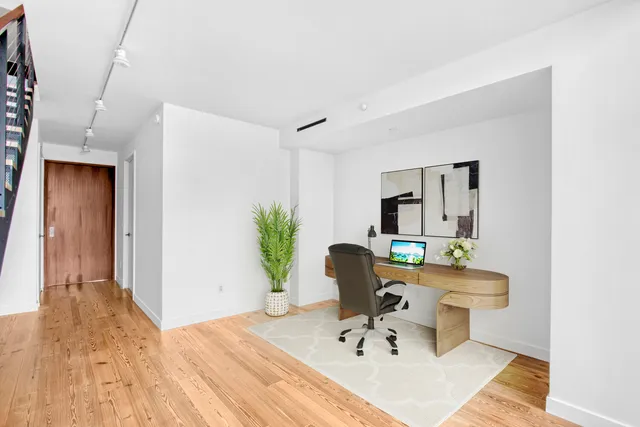 a view of an empty room with stairs
