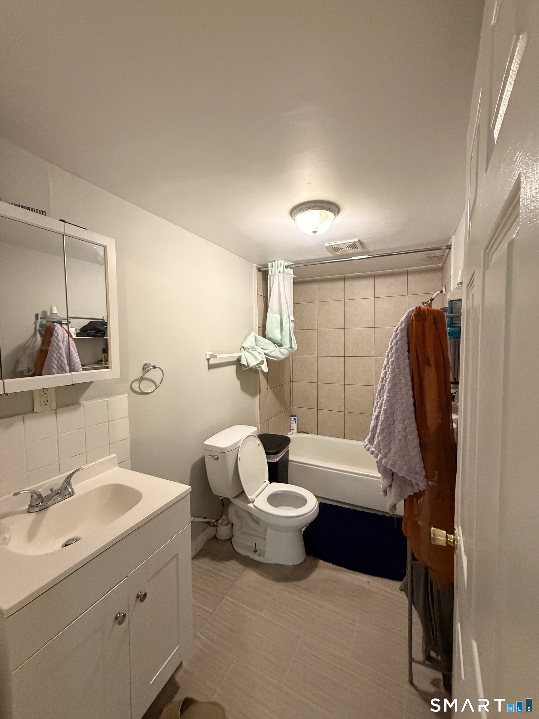 46 Arthur Street New Haven, CT 06519 - Photo 6 of 28 a bathroom with a double vanity sink and mirror