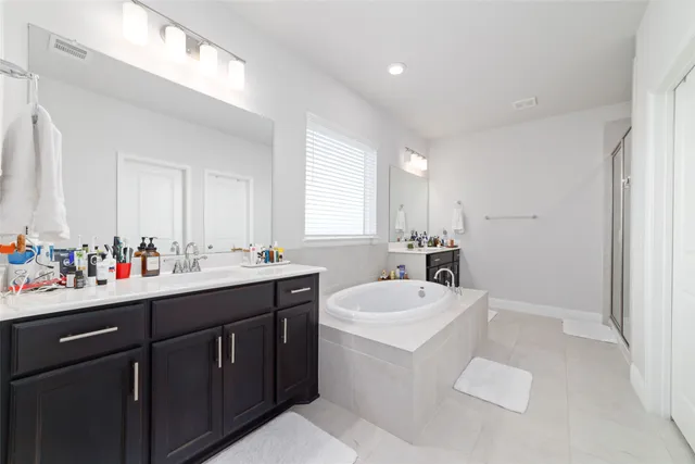 a bathroom with a sink vanity mirror and toilet