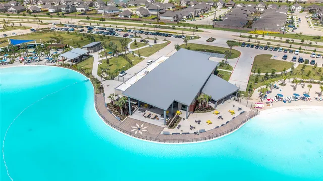 an aerial view of a house with a ocean view