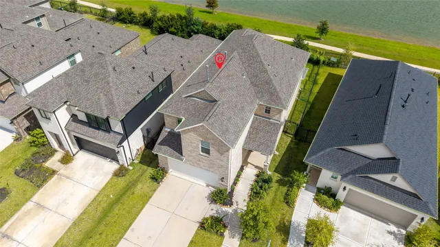 an aerial view of a house with a swimming pool
