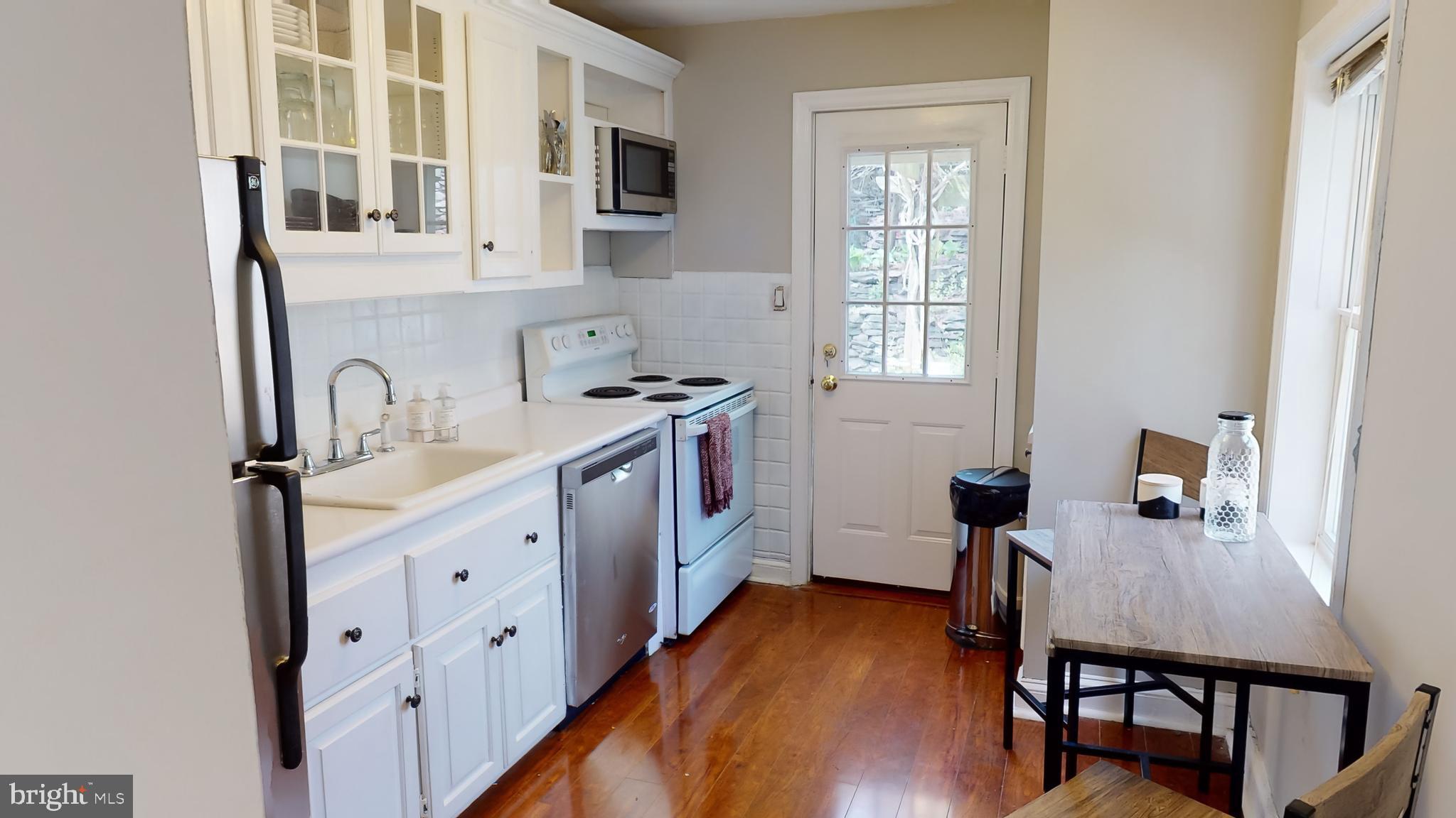107 East Knowlton Road Media, PA 19063 - Photo 8 of 39 Kitchen with Door to Patio