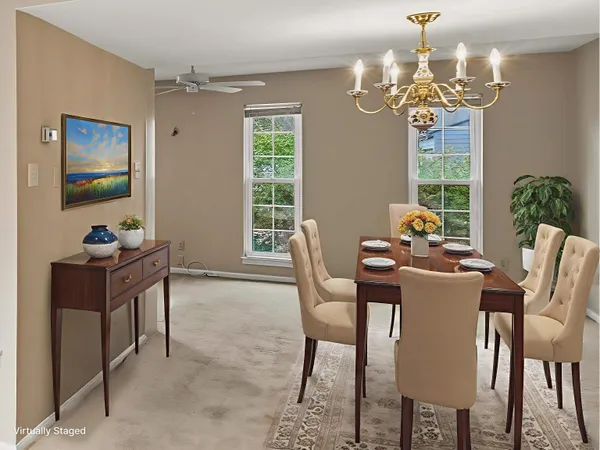 a dining room with furniture a livingroom and chandelier