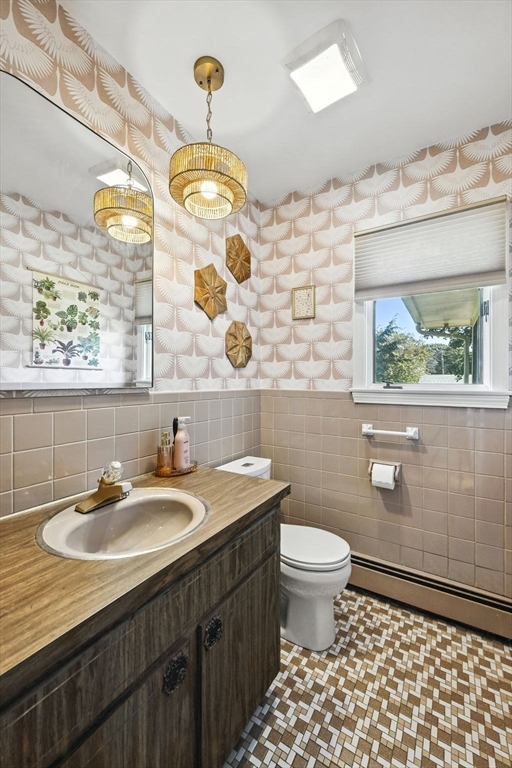 5 Yorkshire Road Marblehead, MA 01945 - Photo 14 of 37 a bathroom with a sink a toilet and a mirror