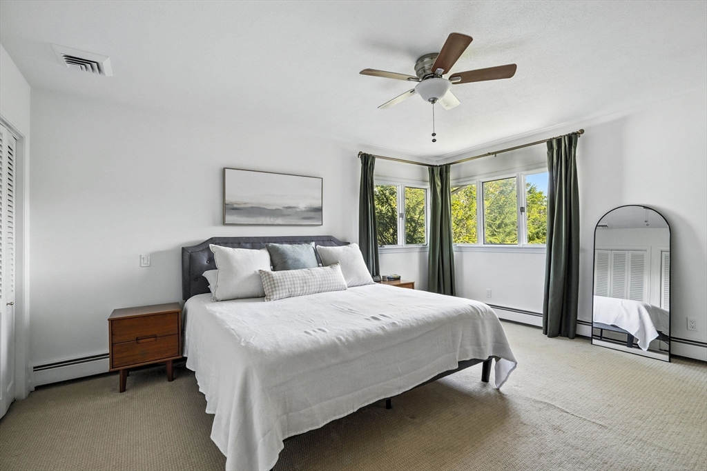 5 Yorkshire Road Marblehead, MA 01945 - Photo 15 of 37 a bedroom with a bed mirror and window