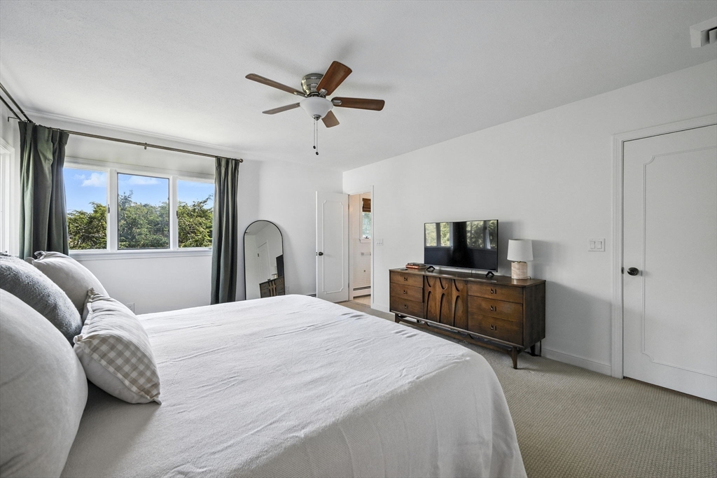 5 Yorkshire Road Marblehead, MA 01945 - Photo 16 of 37 a bedroom with a large bed and a window
