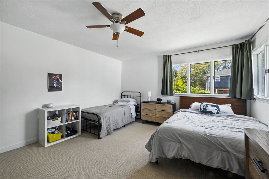 5 Yorkshire Road Marblehead, MA 01945 - Photo 18 of 37 a bedroom with two beds and a large window