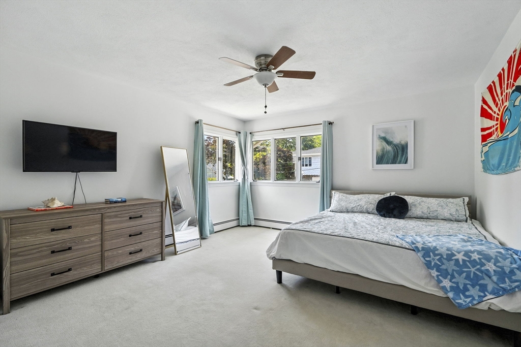 5 Yorkshire Road Marblehead, MA 01945 - Photo 19 of 37 a bedroom with a bed and a flat screen tv