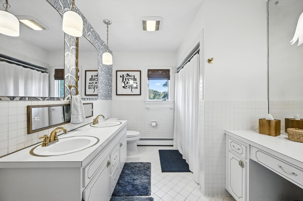 5 Yorkshire Road Marblehead, MA 01945 - Photo 20 of 37 a bathroom with a sink a vanity and a mirror