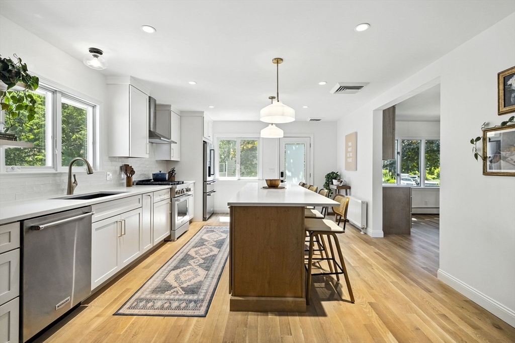 5 Yorkshire Road Marblehead, MA 01945 - Photo 2 of 37 a large kitchen with a table chairs refrigerator and window