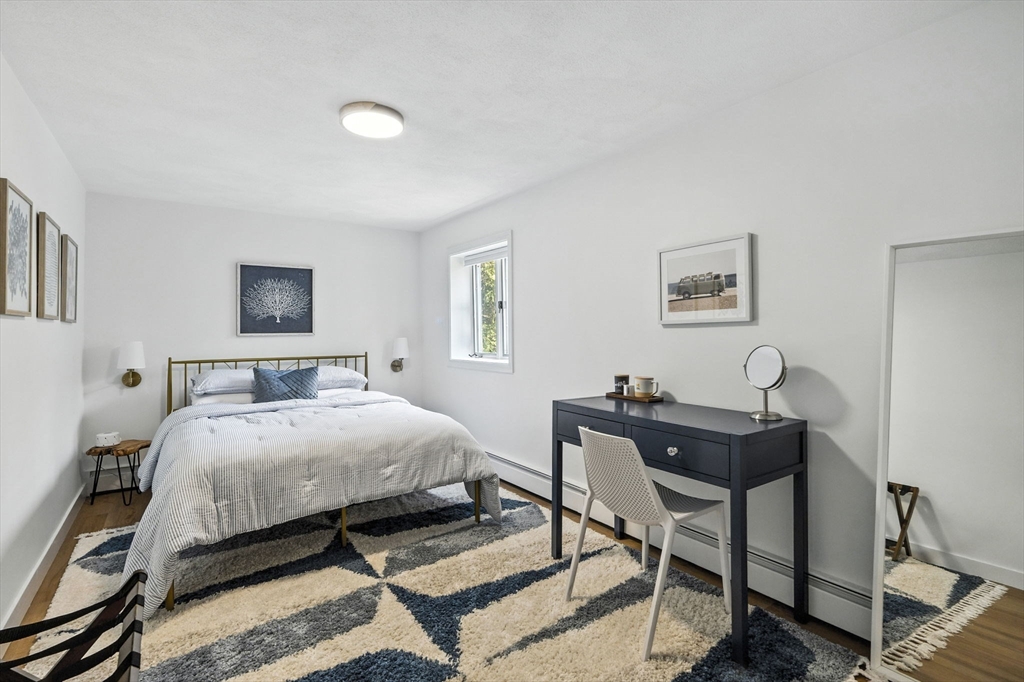 5 Yorkshire Road Marblehead, MA 01945 - Photo 22 of 37 a bedroom with a bed and a desk