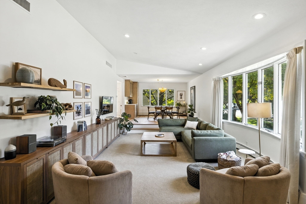 5 Yorkshire Road Marblehead, MA 01945 - Photo 6 of 37 a living room with furniture a rug and a floor to ceiling window