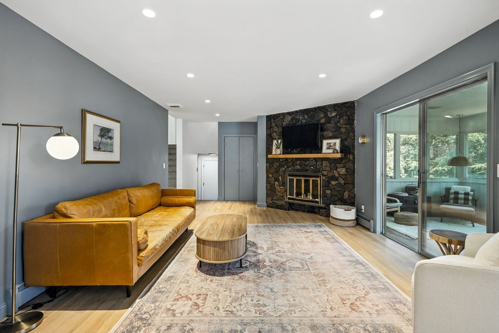 5 Yorkshire Road Marblehead, MA 01945 - Photo 9 of 37 a living room with furniture a flat screen tv and a refrigerator