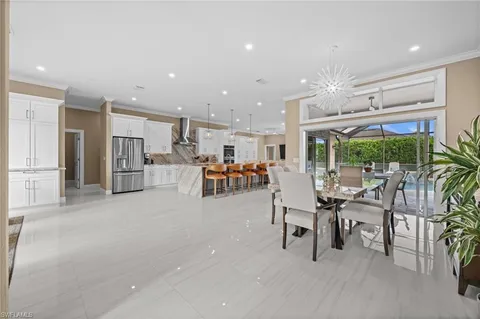 a room with lots of table and chairs