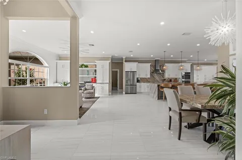 a living room with a sink and a large window