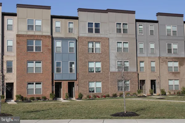 a front view of a building with lot of windows