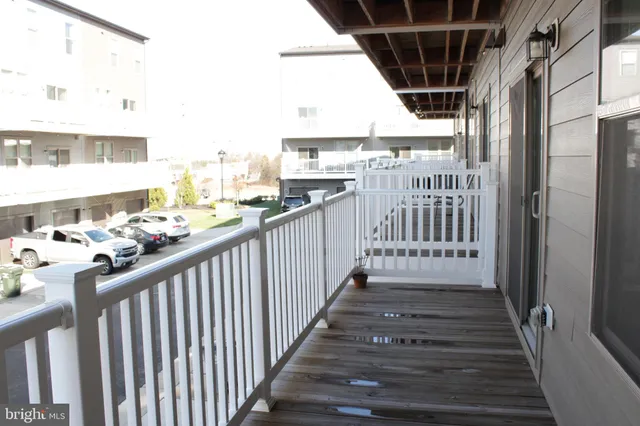 a view of a balcony with wooden floor