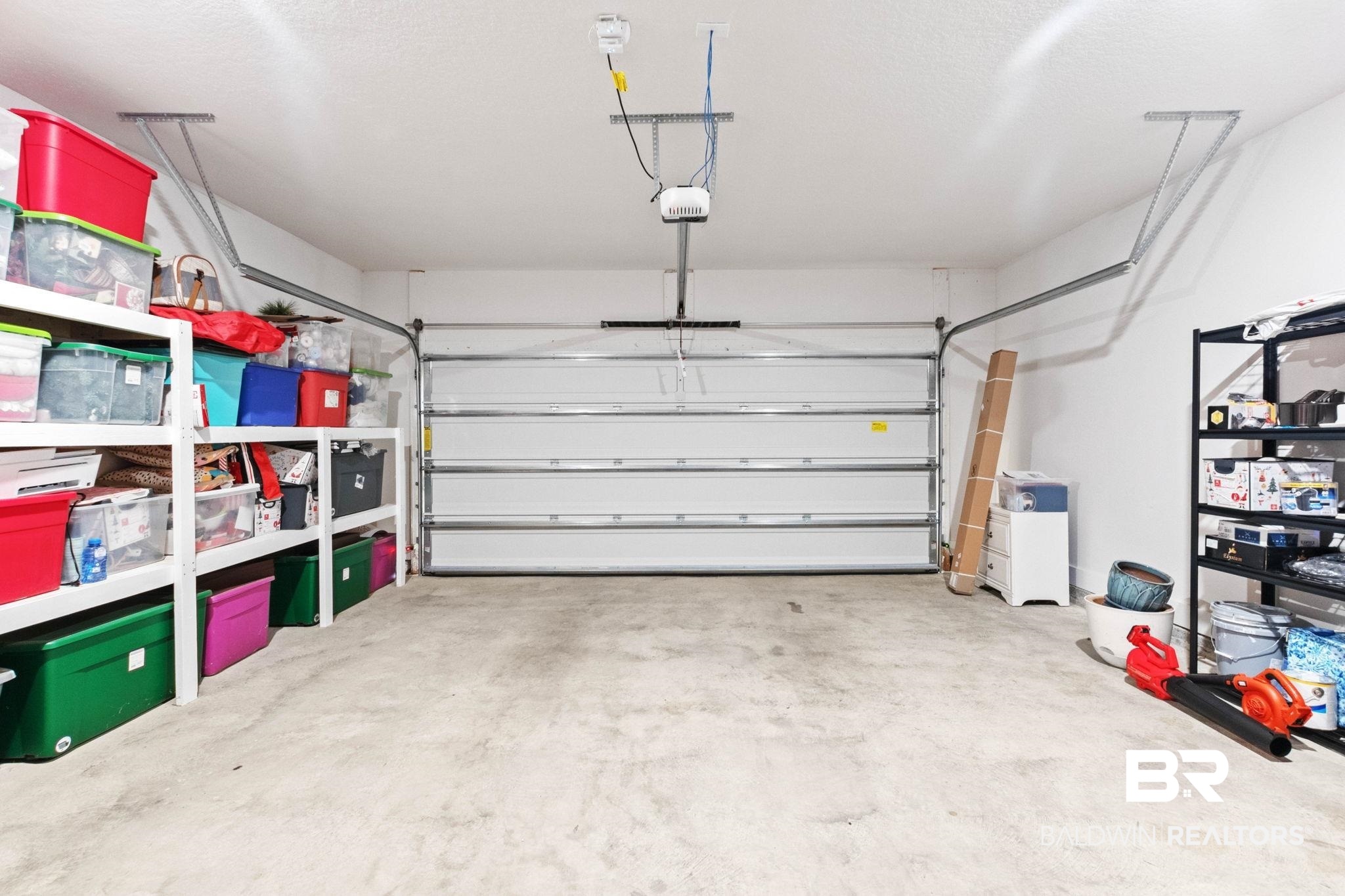 9815 Lakeview Drive Foley, AL 36535 - Photo 57 of 100 Garage featuring a garage door opener