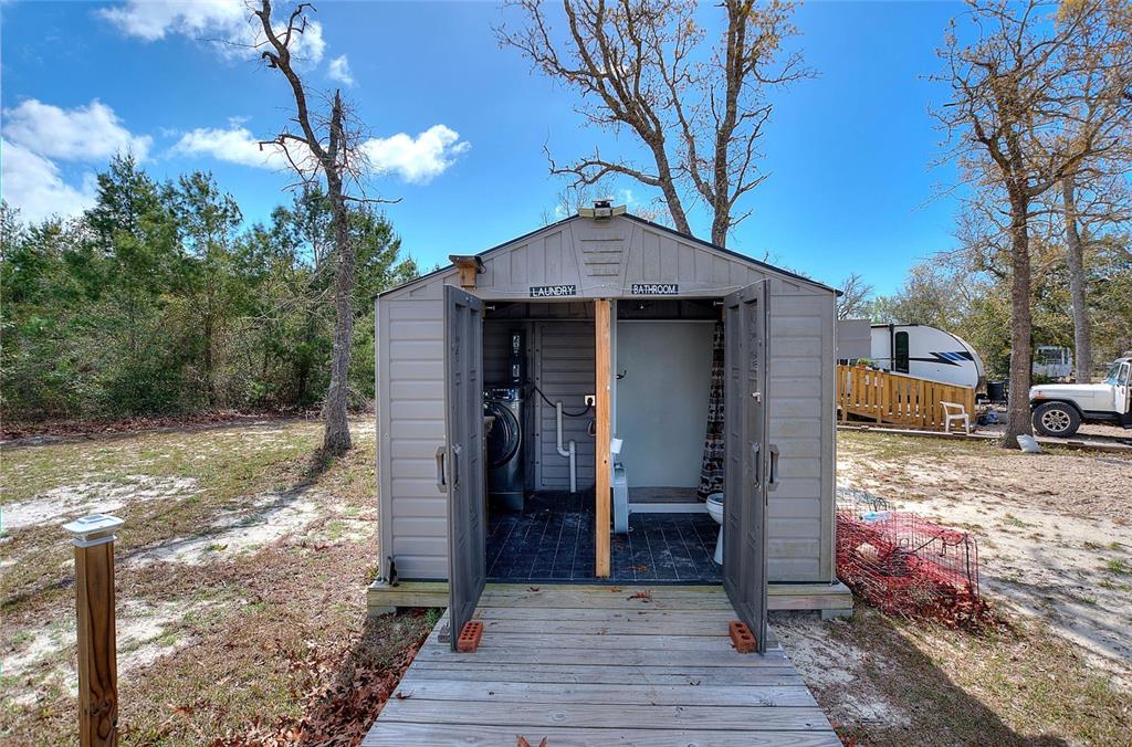 19550 Jody Morgan Road Perry, FL 32348 - Photo 38 of 79 a front view of a house with a yard