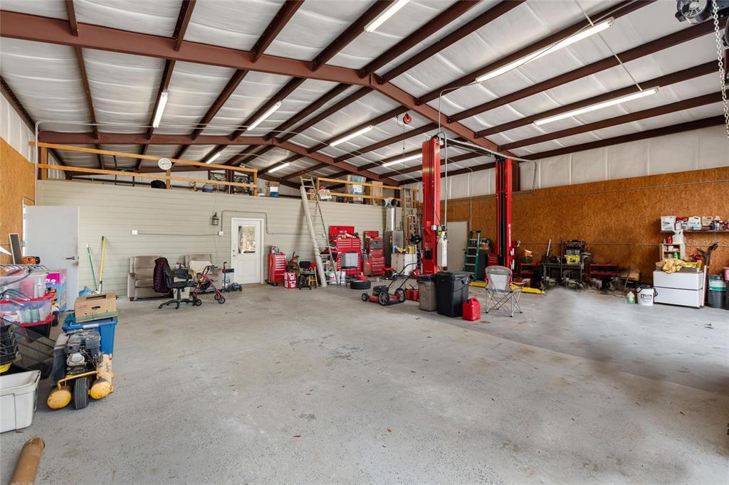 19550 Jody Morgan Road Perry, FL 32348 - Photo 52 of 79 a view of a garage with rack and bicycle