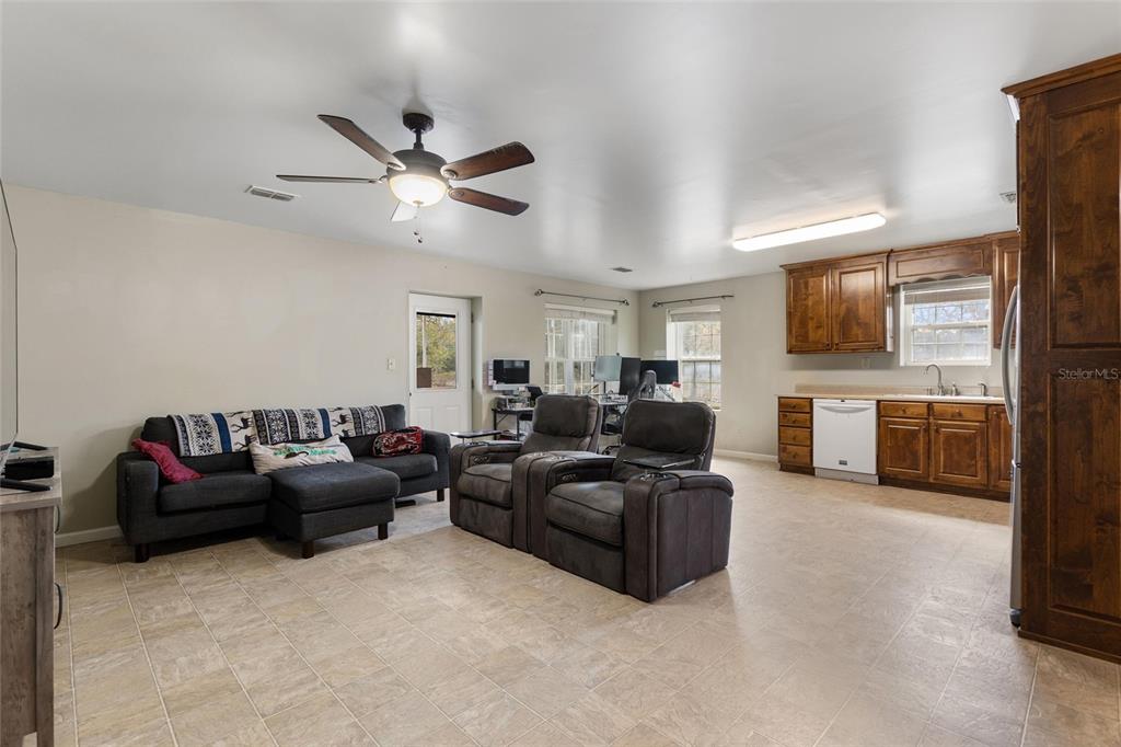 19550 Jody Morgan Road Perry, FL 32348 - Photo 56 of 79 a living room with furniture and kitchen view