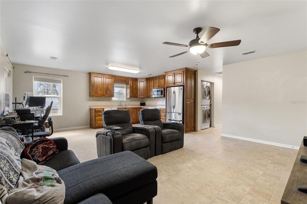 19550 Jody Morgan Road Perry, FL 32348 - Photo 57 of 79 a living room with furniture ceiling fan and a rug