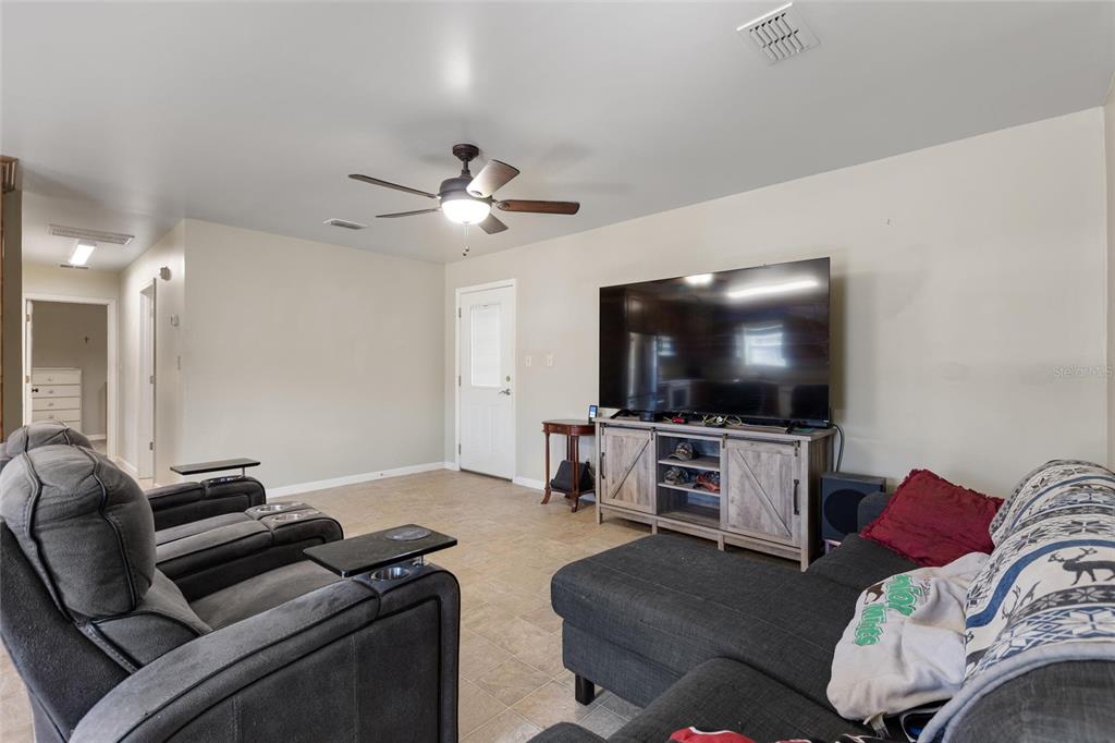 19550 Jody Morgan Road Perry, FL 32348 - Photo 59 of 79 a living room with furniture and a flat screen tv